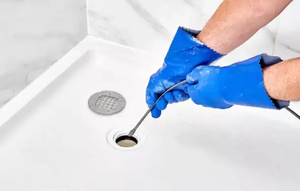 Drain-Cleaning-Service-Using-Plumbing-Snake-Tool